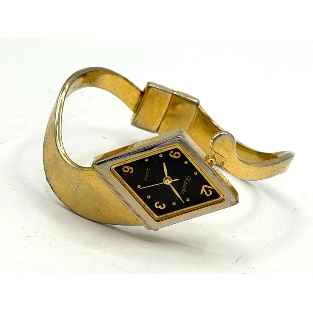 Xanadu Womens Gold Tone Cuff Bangle Watch Black Dial Quartz Running